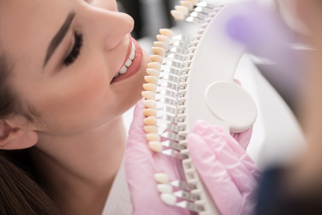 Patient with row of dental crowns